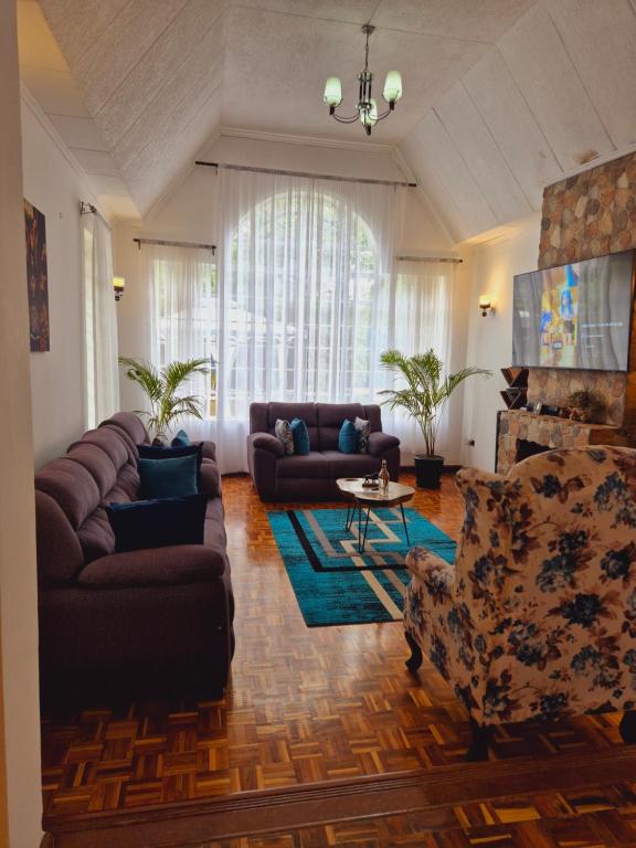 Posezení v ubytování Teresita Home JKIA