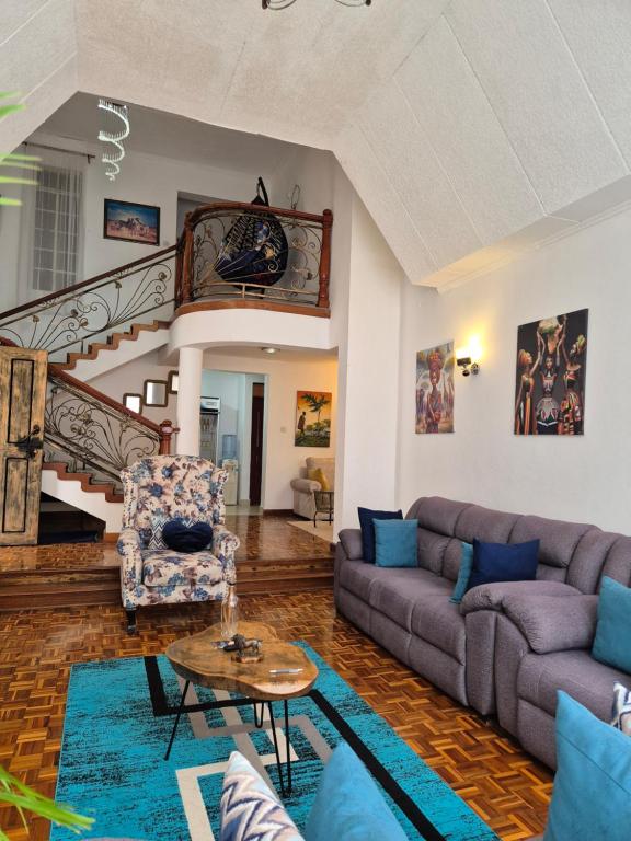 Posezení v ubytování Teresita Home JKIA