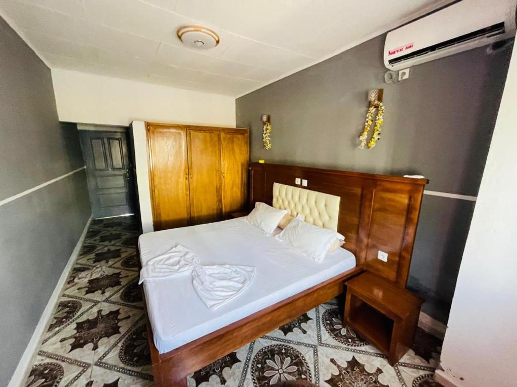 Postel nebo postele na pokoji v ubytování Hotel Résidences des Hotes