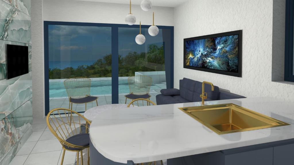 kuchnia ze zlewem i salonem w obiekcie Avithos Blue Villas w mieście Svoronata