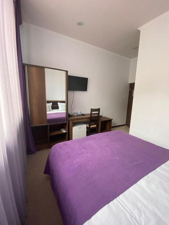 Postel nebo postele na pokoji v ubytování Mina Hotel