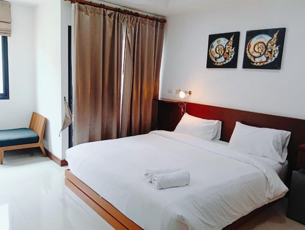 Postel nebo postele na pokoji v ubytování YON INN Sukhumvit 4 Bangkok - BTS Nana