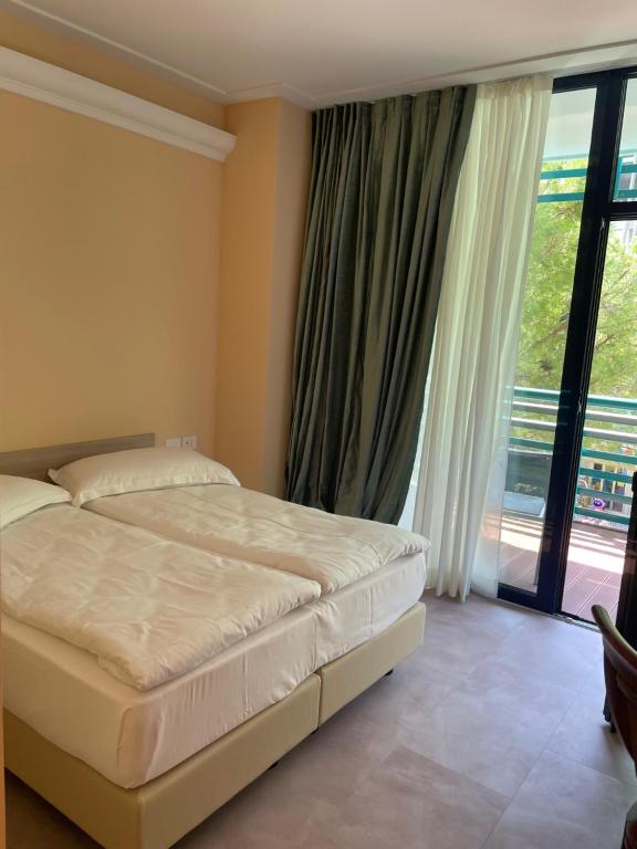 Postel nebo postele na pokoji v ubytování Grand Hotel Astoria