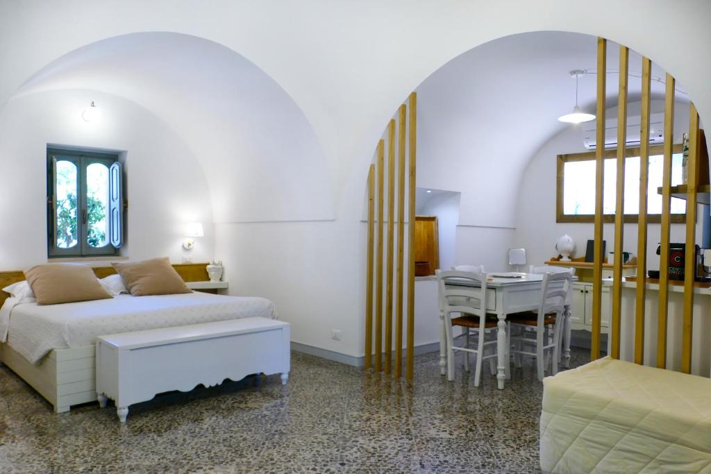 Postel nebo postele na pokoji v ubytování Trullo Porta Antica