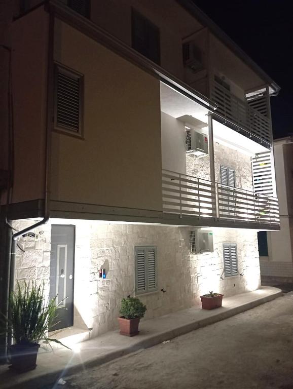 a building with a balcony on the side of it at Case Vacanze Angolo Sul Mare in Nicotera Marina