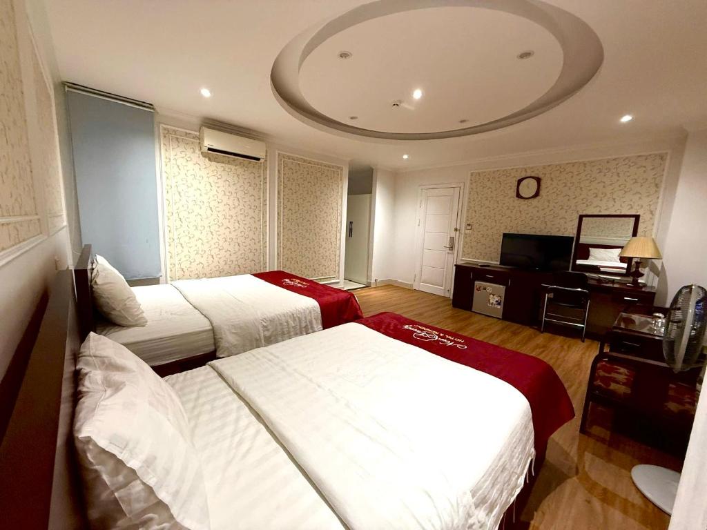 Postel nebo postele na pokoji v ubytování New Amely Hotel