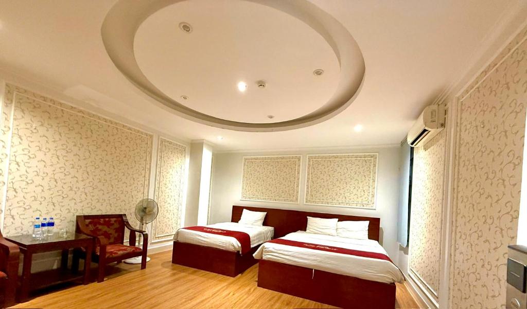 Postel nebo postele na pokoji v ubytování New Amely Hotel