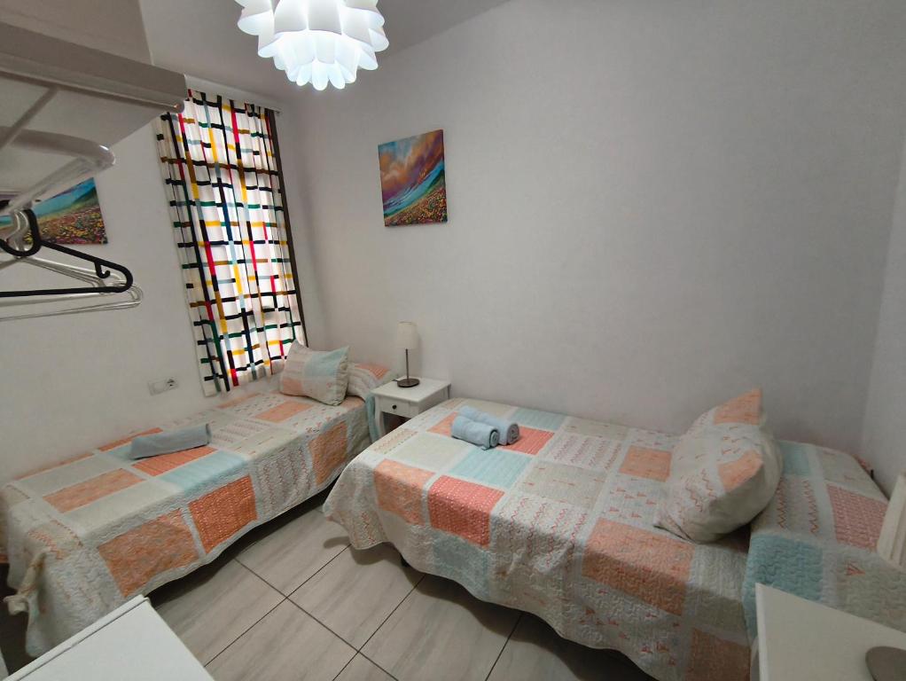 Postel nebo postele na pokoji v ubytování Apartamento el Carmen