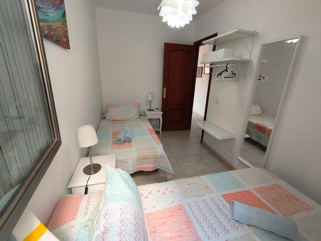 Postel nebo postele na pokoji v ubytování Apartamento el Carmen