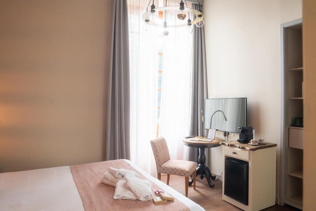 Postel nebo postele na pokoji v ubytování Hotel Emblemático Agáldar
