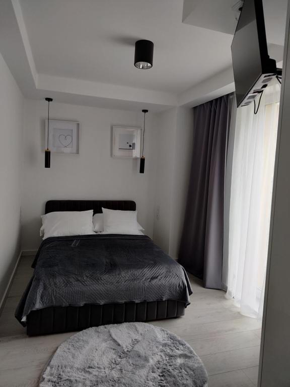 Un pat sau paturi într-o cameră la Apartamenty Klifowa Rewal