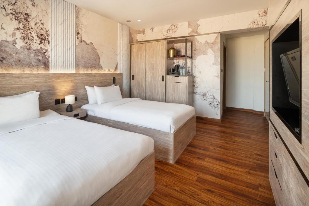 Postel nebo postele na pokoji v ubytování Regency Inn