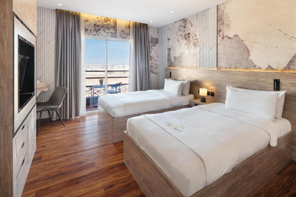 Postel nebo postele na pokoji v ubytování Regency Inn