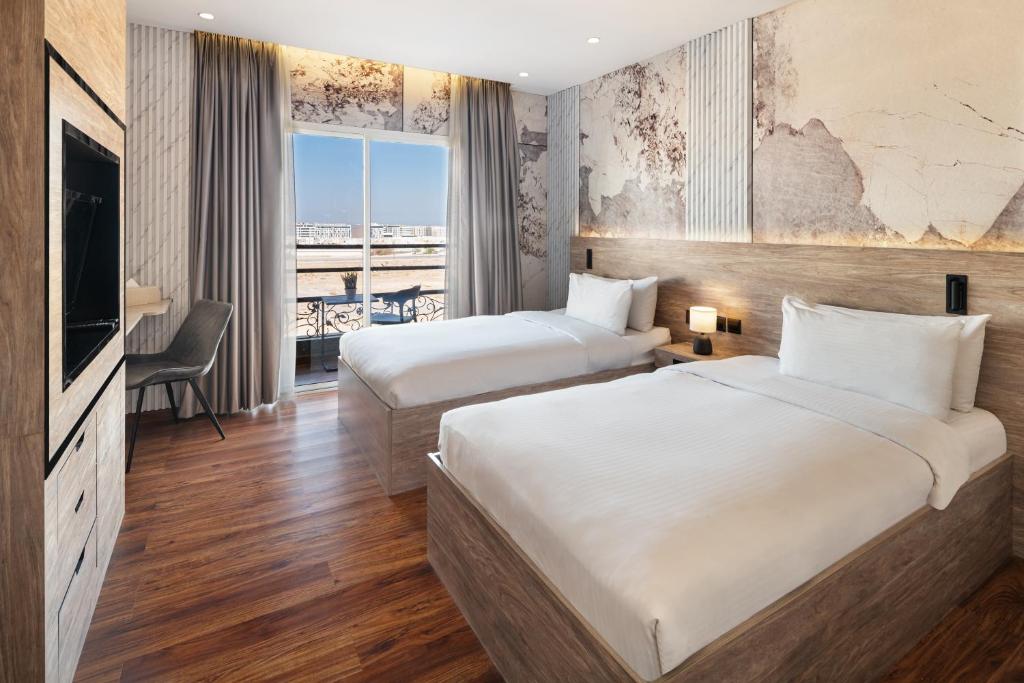 Postel nebo postele na pokoji v ubytování Regency Inn