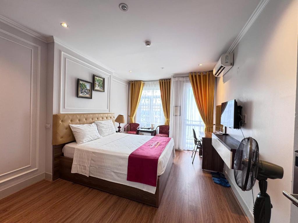 Postel nebo postele na pokoji v ubytování New Amely Hotel