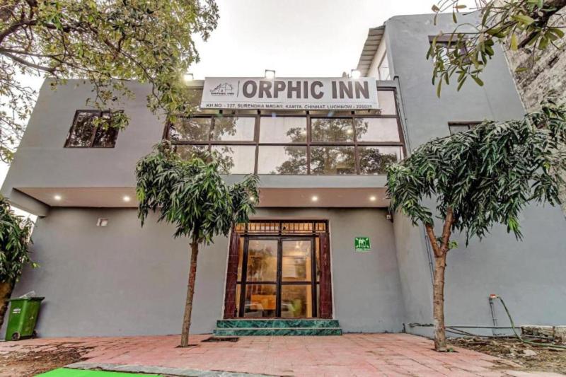 a building with a sign that reads organic inn at RROOMS Hotel Orphic Inn in Lucknow
