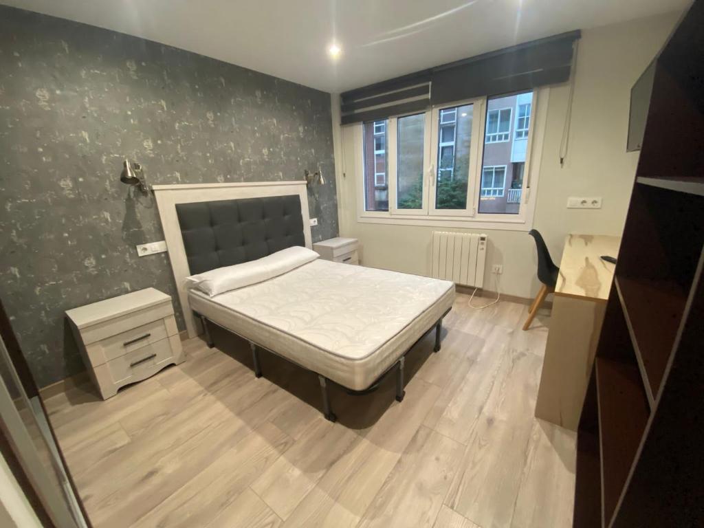 Posteľ alebo postele v izbe v ubytovaní Residencia Compostela
