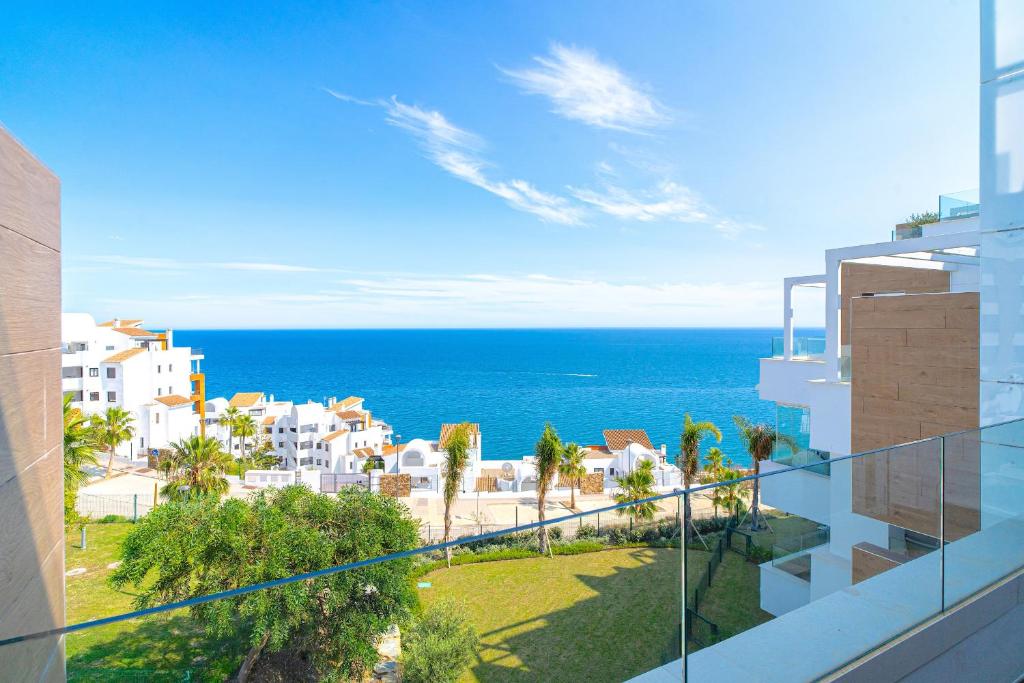 a view of the ocean from the balcony of a building at Luxury Rooftop Isea 1132 by Casasol in Torrox Costa