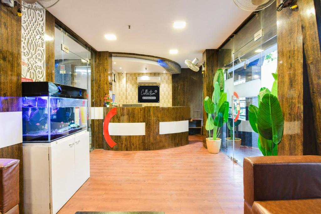 a lobby with a fish tank in a store at Collection O Park Circus in Kolkata