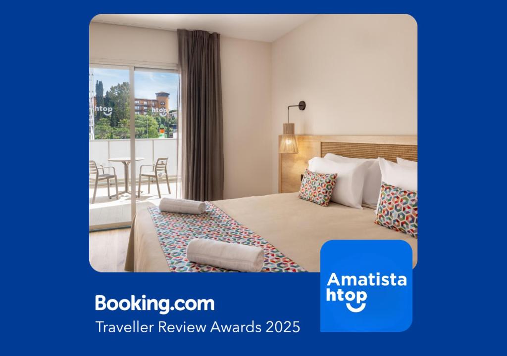a hotel room with a bed and a balcony at htop Amatista #htopBliss in Lloret de Mar