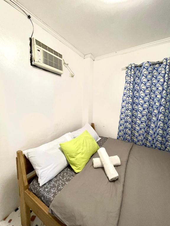 Postel nebo postele na pokoji v ubytování Dayo Siargao