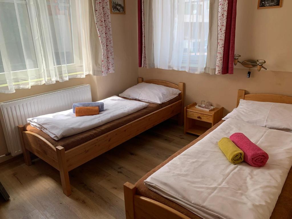 Postel nebo postele na pokoji v ubytování Pension U Pece