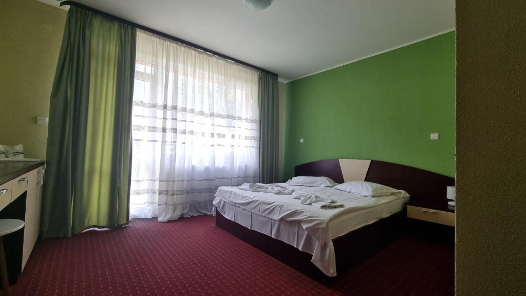 Postel nebo postele na pokoji v ubytování Hotel Iri
