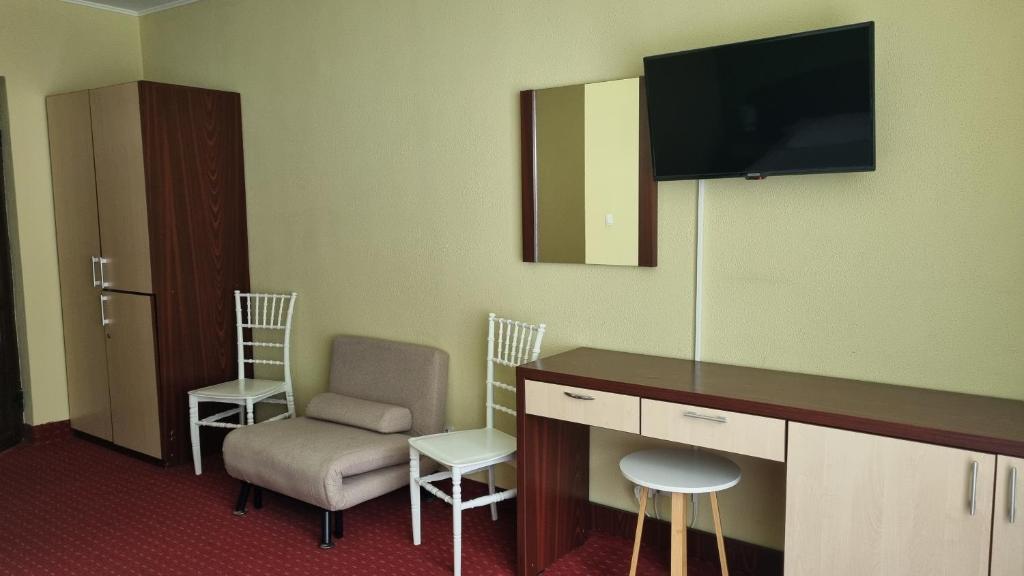 TV a/nebo společenská místnost v ubytování Hotel Iri