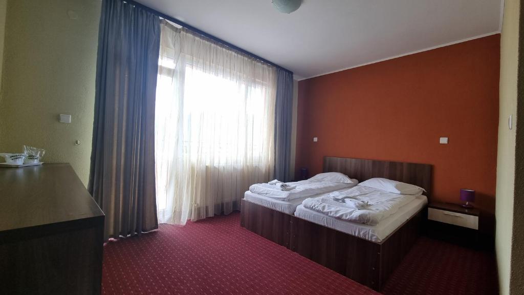 Postel nebo postele na pokoji v ubytování Hotel Iri