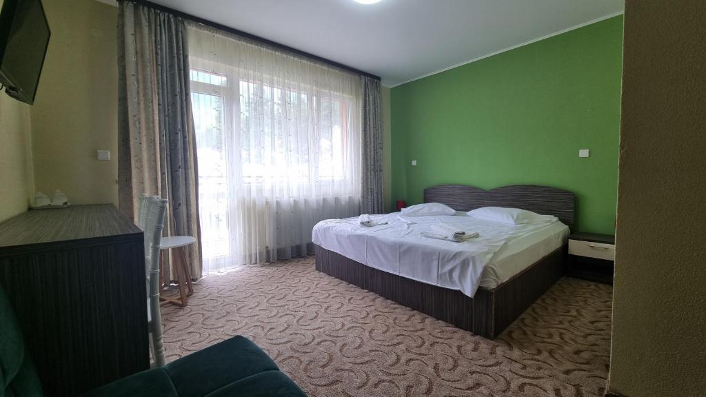 Postel nebo postele na pokoji v ubytování Hotel Iri
