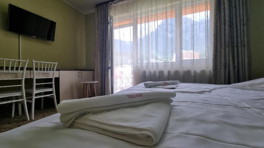Postel nebo postele na pokoji v ubytování Hotel Iri