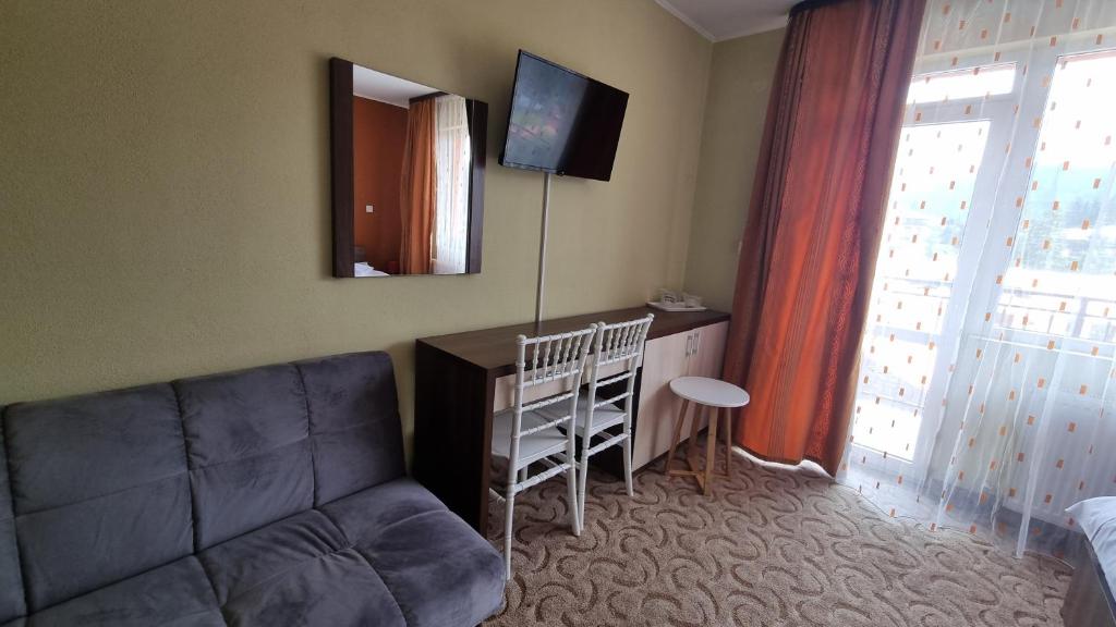 TV a/nebo společenská místnost v ubytování Hotel Iri