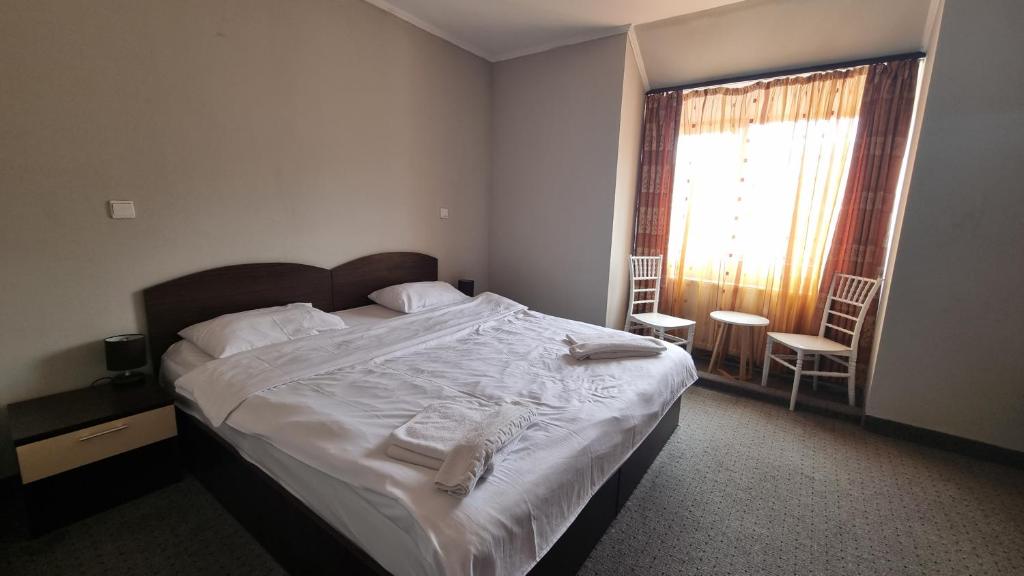Postel nebo postele na pokoji v ubytování Hotel Iri