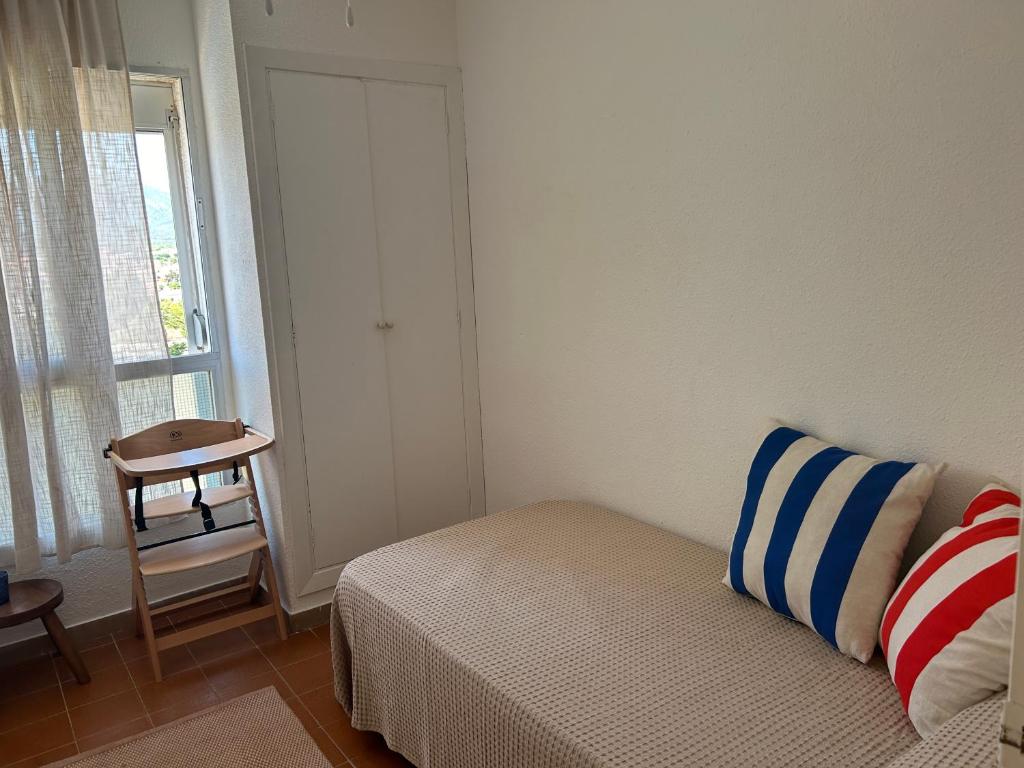 A bed or beds in a room at MIAMI PLAYA SIRENS en Cala Sirenas FREE WIFI