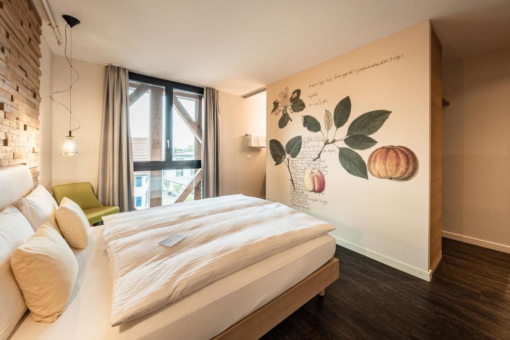Postel nebo postele na pokoji v ubytování Hotel Greuterhof Islikon