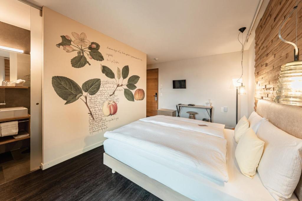 Postel nebo postele na pokoji v ubytování Hotel Greuterhof Islikon
