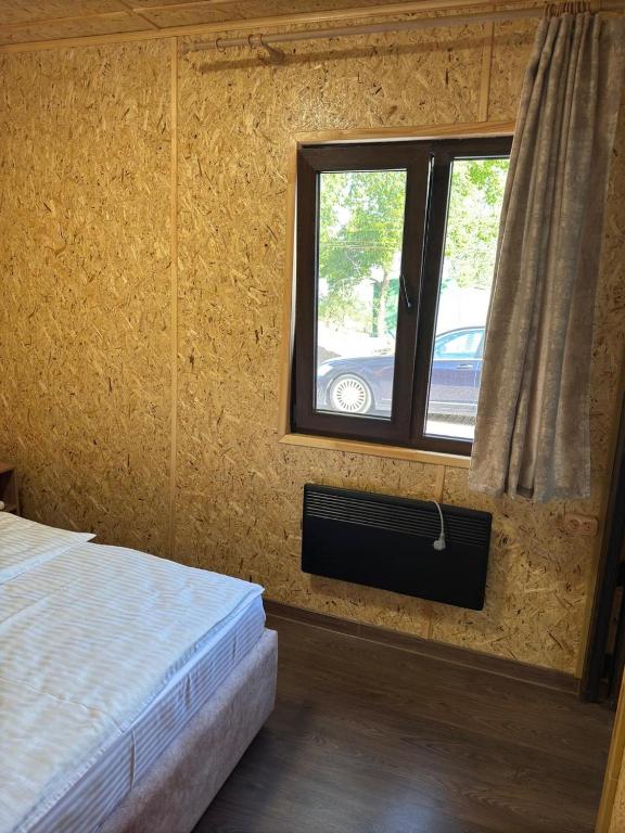 Postel nebo postele na pokoji v ubytování Hayots Ojakh