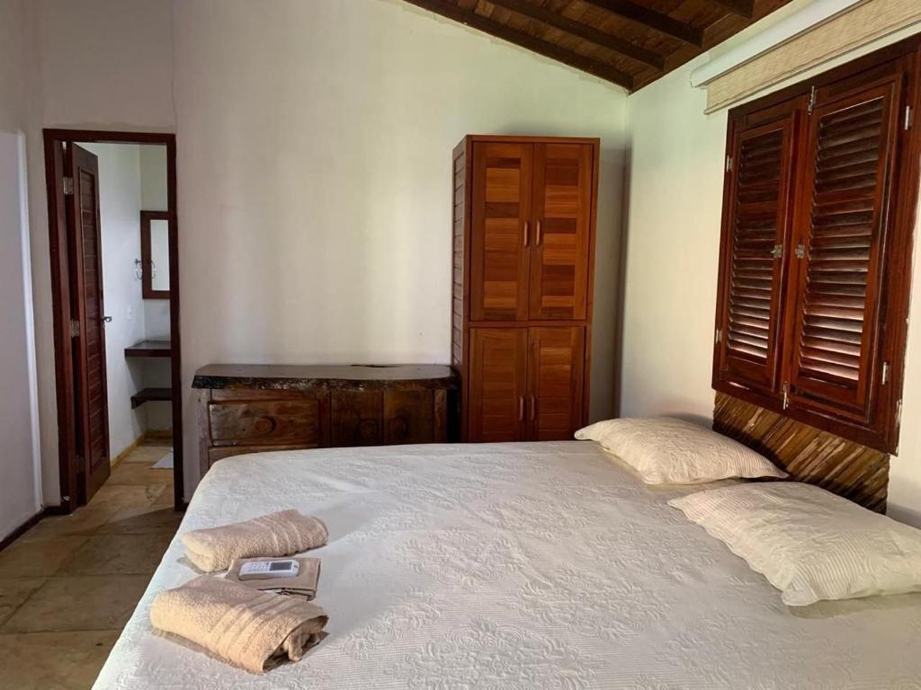 Postel nebo postele na pokoji v ubytování Chalés da Rosinha