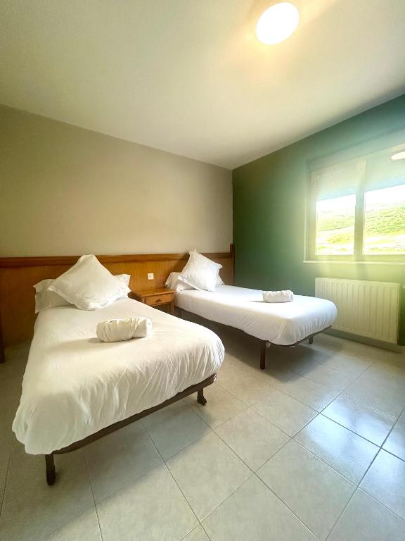 Postel nebo postele na pokoji v ubytování Coronel Somiedo by Unusual Hotels