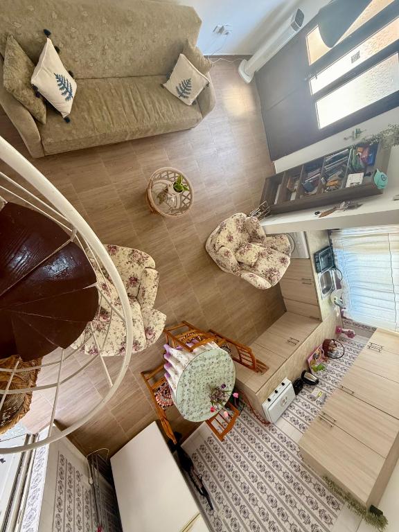 an overhead view of a living room with a couch and chairs at Arsinoe Guest House in Famagusta