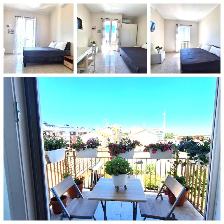 a room with a balcony with a bed and a table at Casa Dolce Casa in Termoli