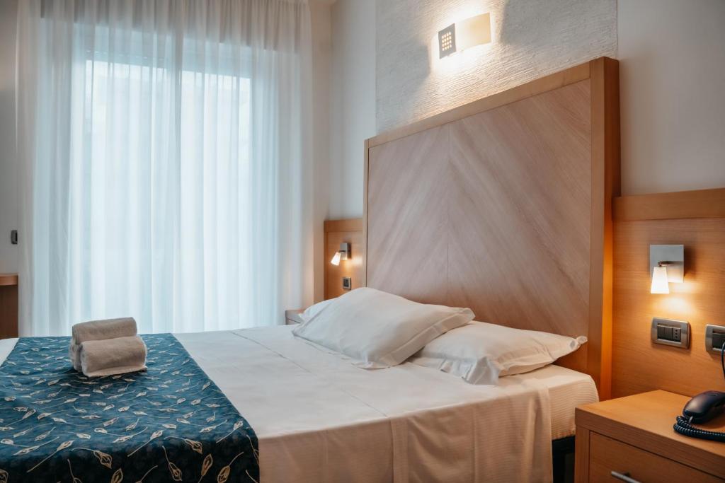 Postel nebo postele na pokoji v ubytování Hotel Tropical