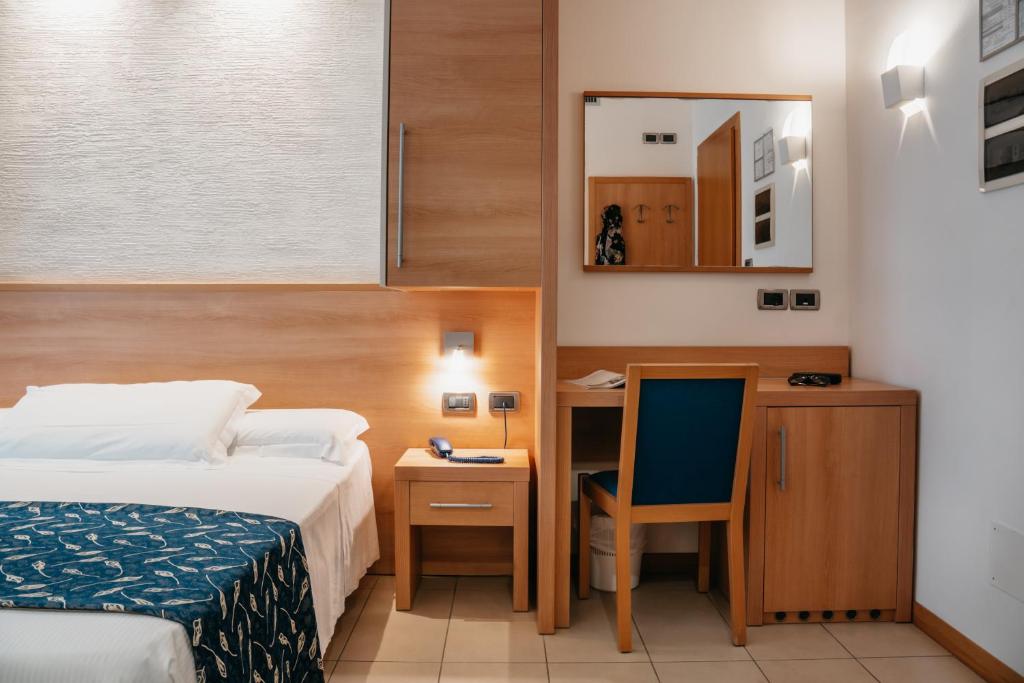 Postel nebo postele na pokoji v ubytování Hotel Tropical