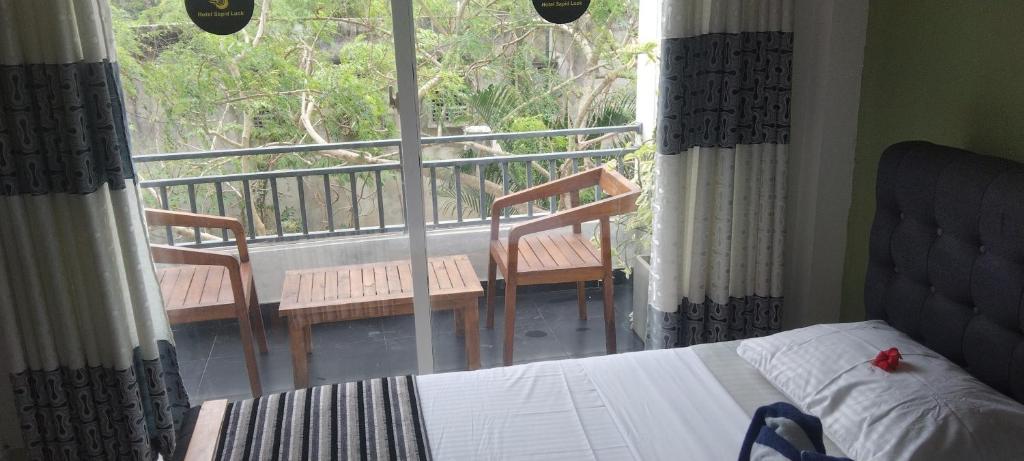 Postel nebo postele na pokoji v ubytování Hotel Sapid Luck Yala Safari