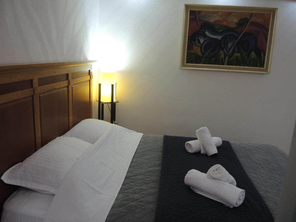 Postel nebo postele na pokoji v ubytování Rooms&Restaurant 43
