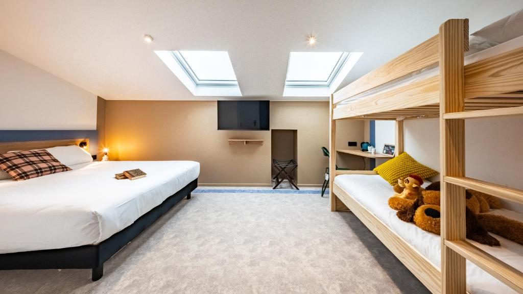Postel nebo postele na pokoji v ubytování greet Hotel Massieux Lyon Nord