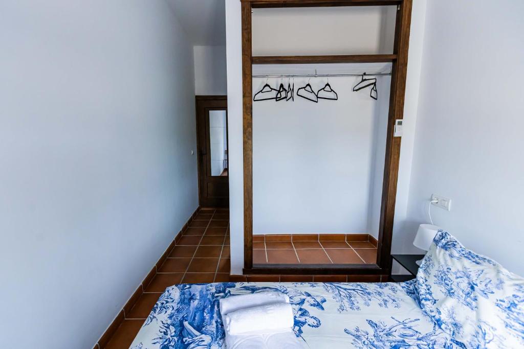 Postel nebo postele na pokoji v ubytování HN Romero 58