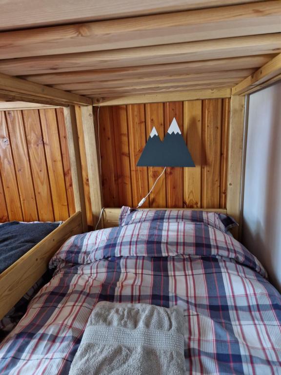 Postel nebo postele na pokoji v ubytování le chalet pointu de capucine