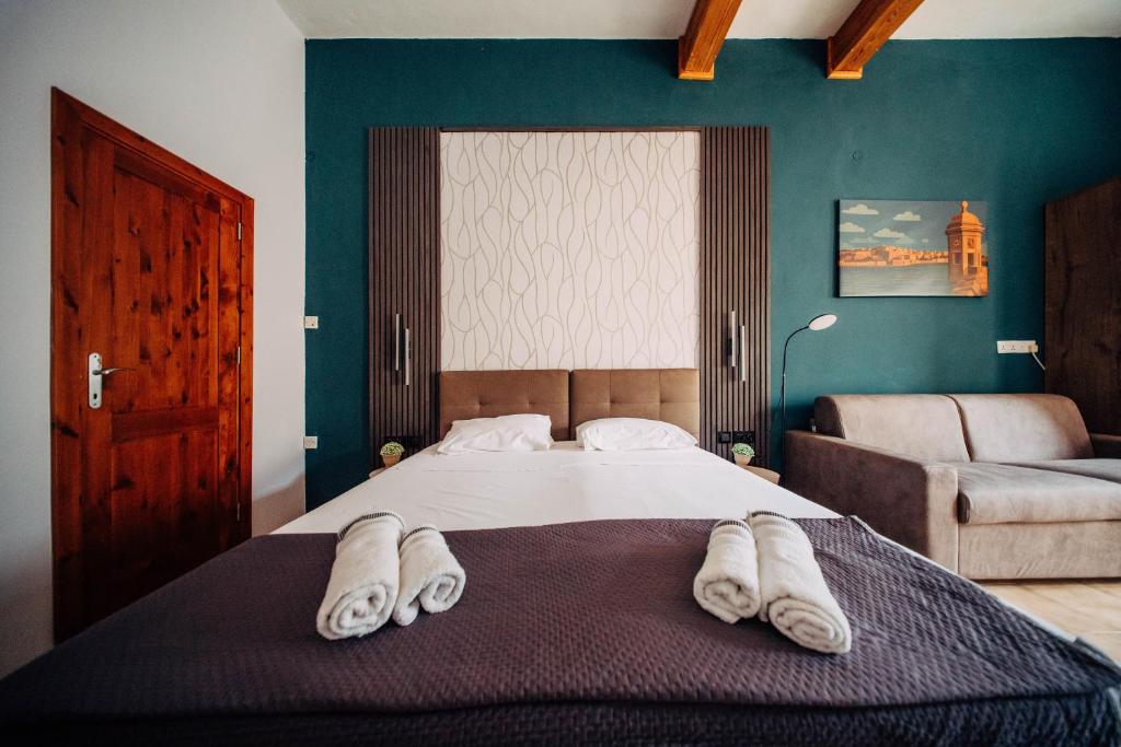 Postel nebo postele na pokoji v ubytování Rapture Gozo - Guesthouse