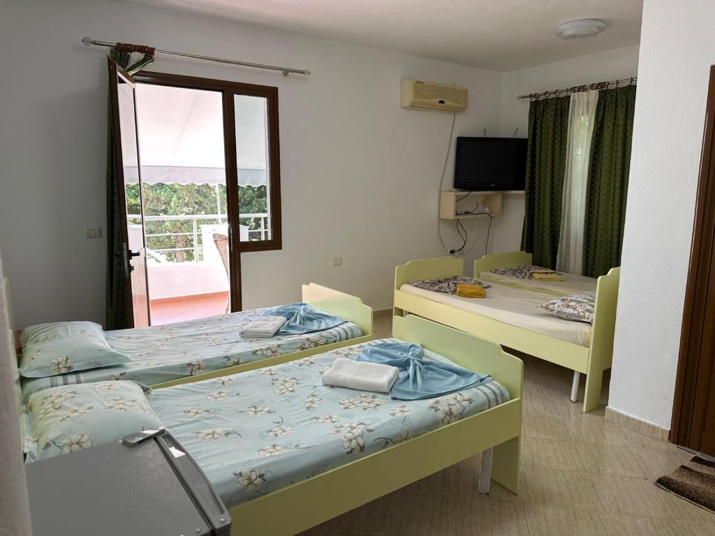 Postel nebo postele na pokoji v ubytování Hotel Moris